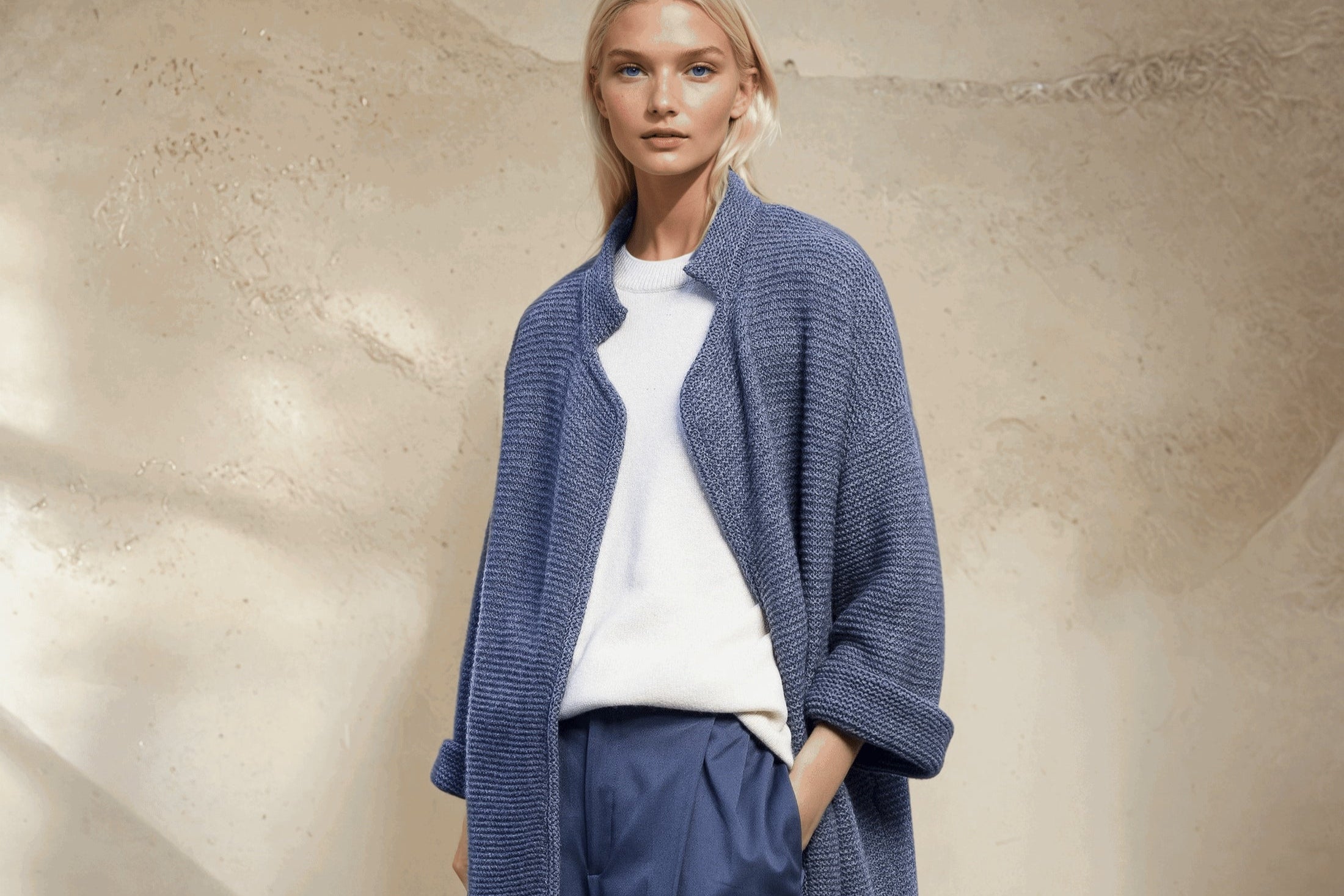 Loose high neck cashmere cardigan in grey.