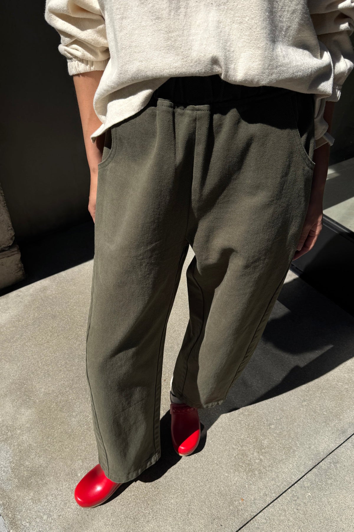 Model wearing olive green colored ardc pants
