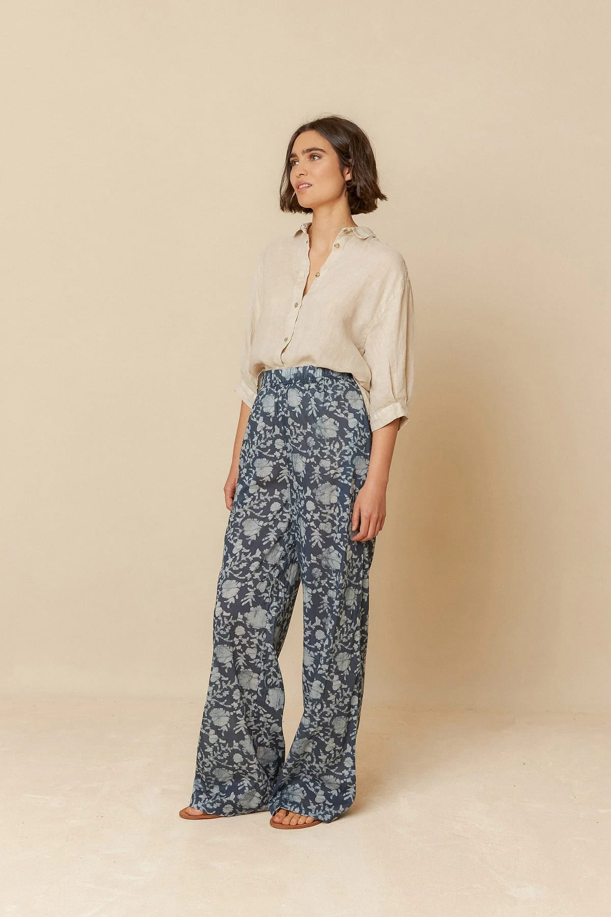 Model dressed in a breathable short sleeve linen shirt.