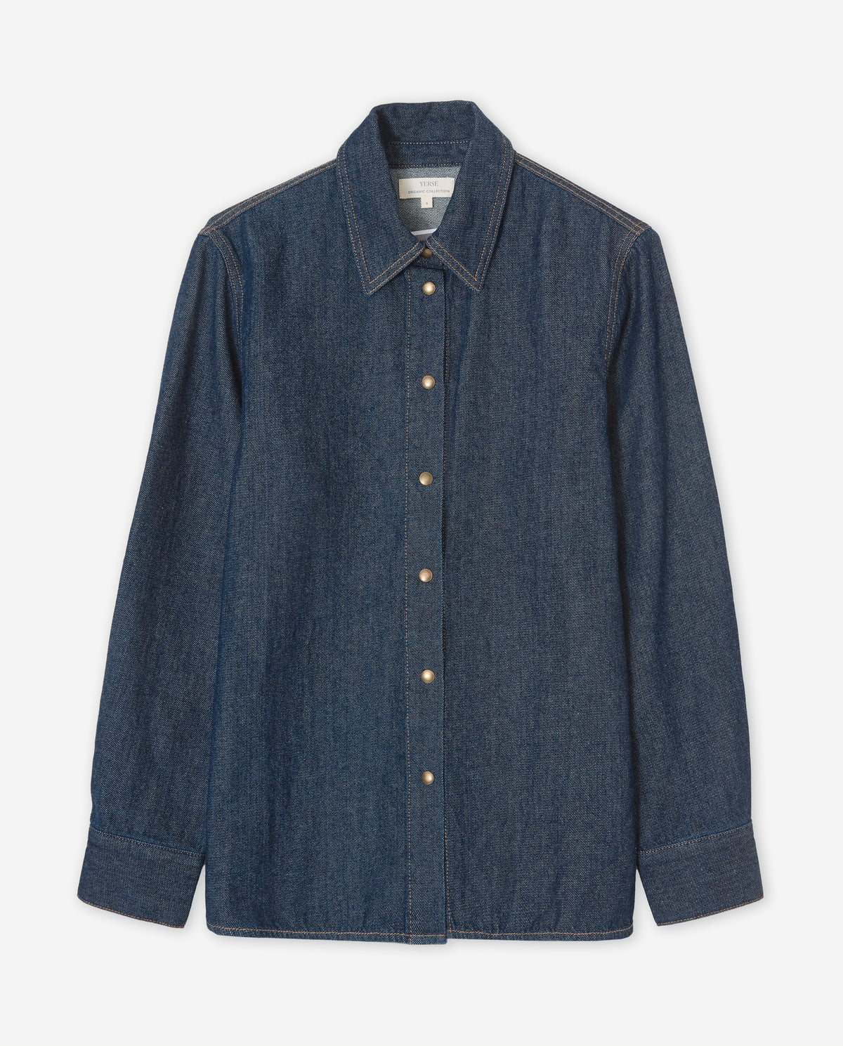 A dark blue denim long-sleeve button-up shirt with a pointed collar and light-colored buttons, displayed flat against a light gray background.