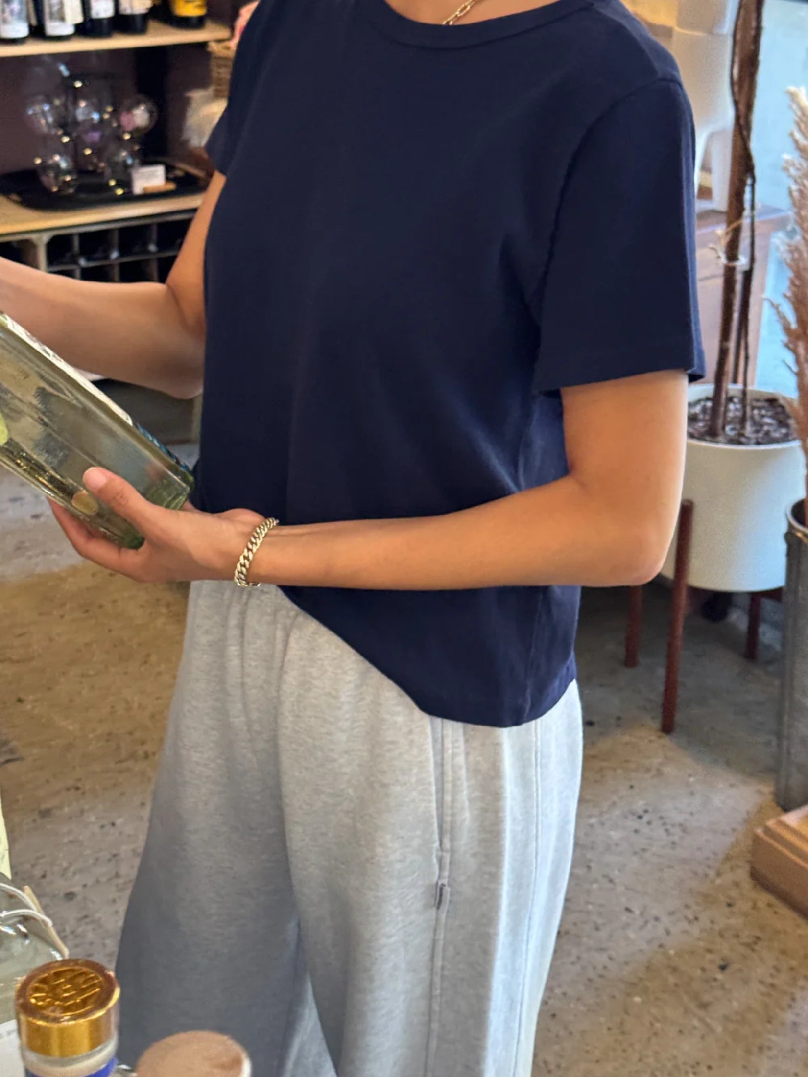 Model wearing a navy short cotton t-shirt with a relaxed fit.