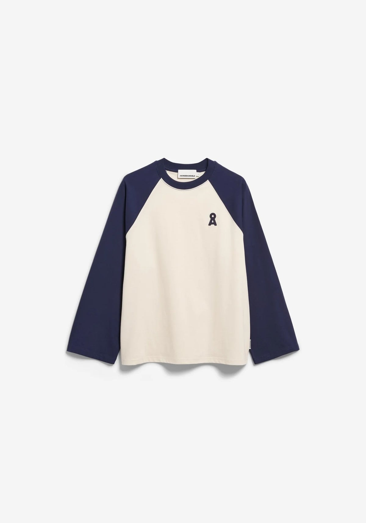 A long-sleeve raglan t-shirt with a cream-colored body and navy blue sleeves, featuring a small navy ribbon graphic on the left chest, displayed on a clean white background.