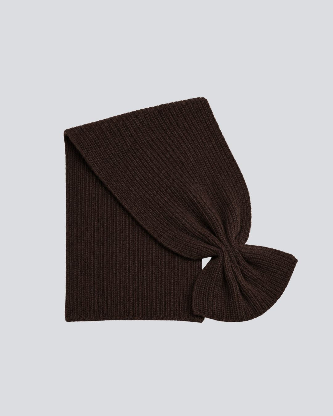 A dark brown ribbed knit headband with a knotted front detail, displayed flat on a light gray background.